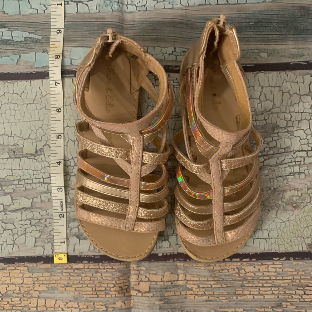 Beautiful brown and gold shiny sandals for a little girl in excellent condition.